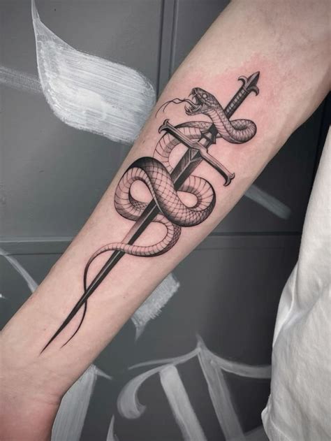 Snake With Dagger Tattoo Meaning