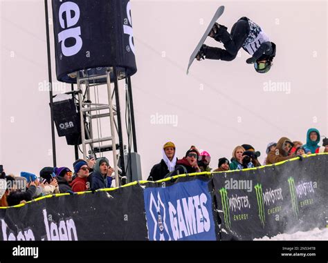 Image of snowboarders performing tricks in a halfpipe