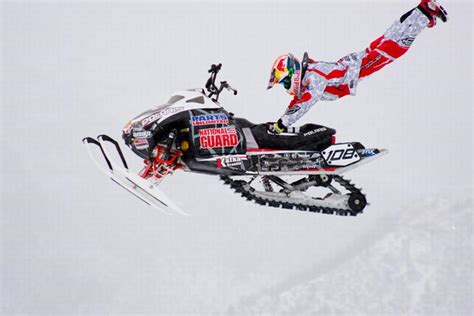 Image of a snowmobile rider performing a backflip