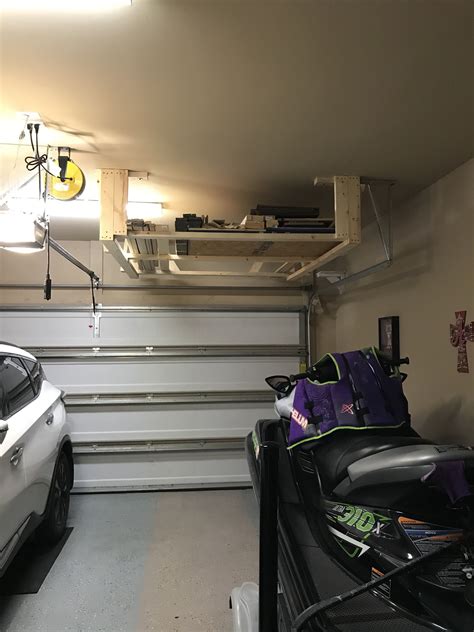 Garage storage rack above garage door made from unit strut and allthread. rusedrack Diy