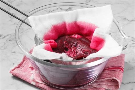 Straining beet juice to remove pulp