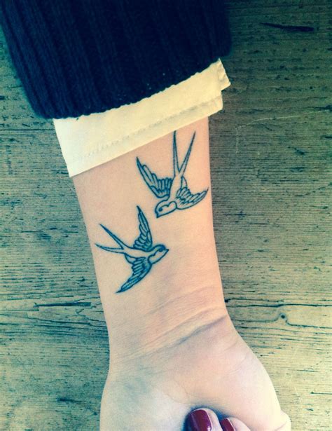 Black and gray swallows tattoo on wrist Tattoos Book