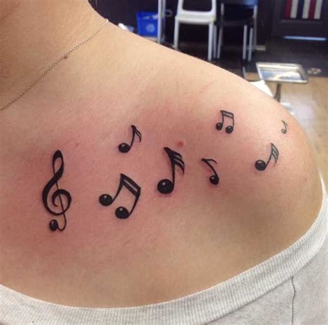 Tattoo Designs Of Music Notes
