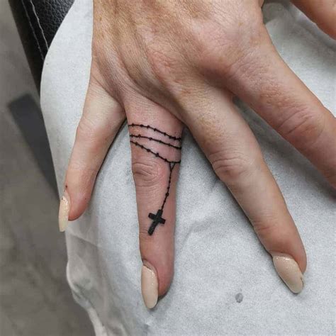 Tattoo Of Cross On Finger