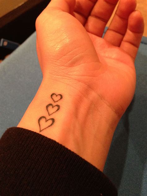 Tattoo Of Heart On Hand
