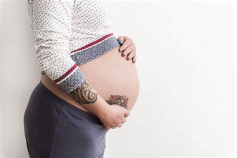 35 Interesting Pregnancy Tattoos Designs & Ideas Pictures