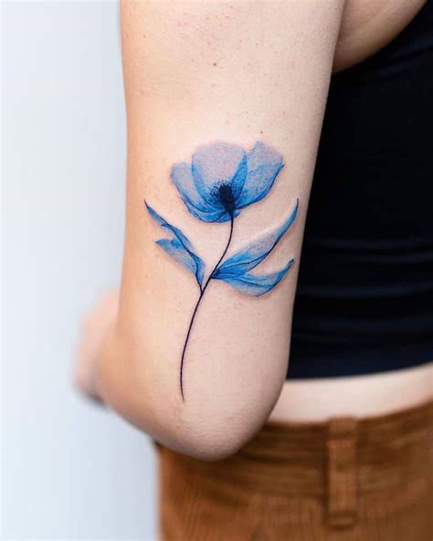 Unravel the Enigmatic Aura of the Blue Ink: Intriguing Tattoo Designs for the Bold and the Beautiful