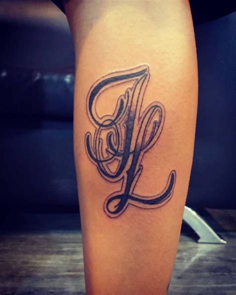 Tattoos With Initials In A Design