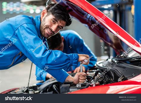 Technician Checking Car Damage