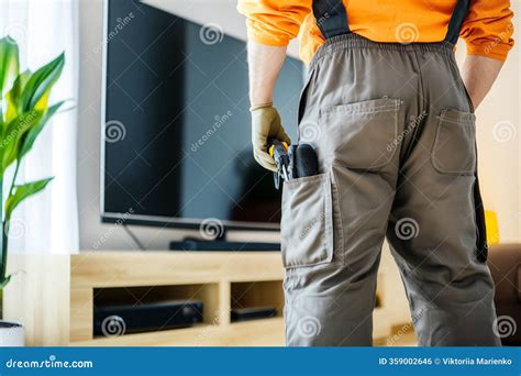 Technician Examining TV Screen