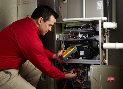 Technician Inspecting Furnace