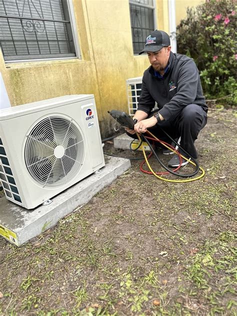 Technician Repairing Ductless Mini-Split