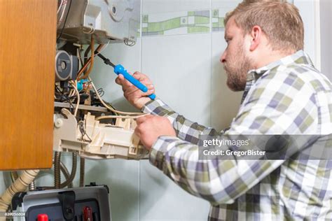 Technician Repairing Furnace