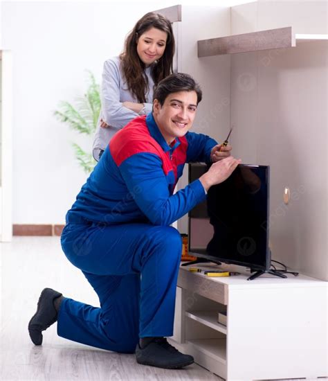 Technician Repairing TV