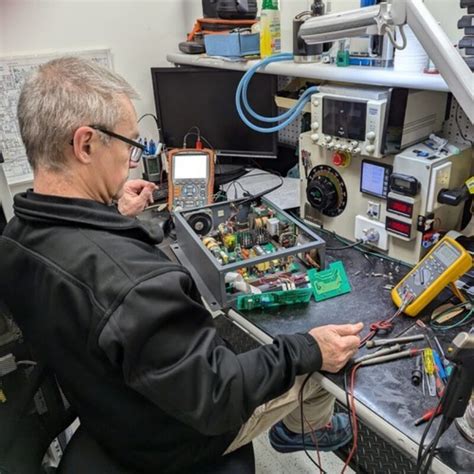 Technician diagnosing electronic device