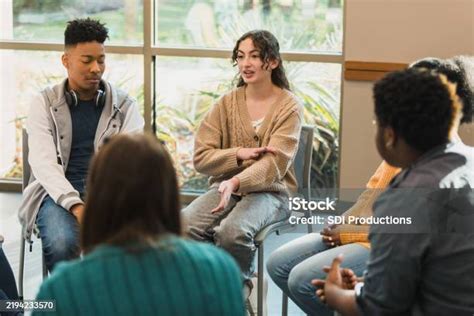 Teenagers talking in therapy session Springfield