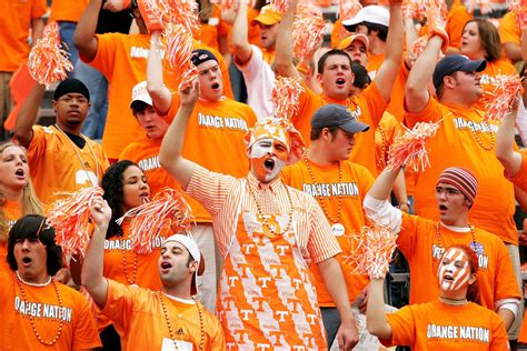 Tennessee Volunteers fans wearing hats at a game
