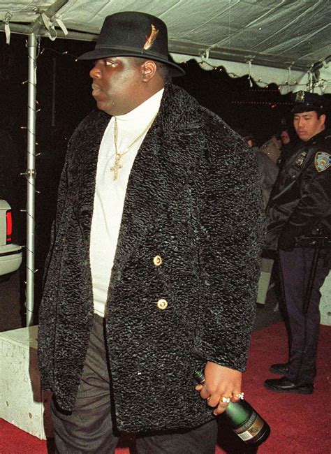 The Notorious B.I.G. wearing a fur coat