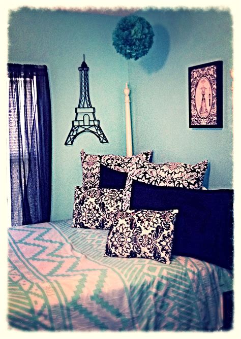 Image of a Tiffany blue bedroom with a canopy bed, draped in sheer curtains and adorned with fairy lights.