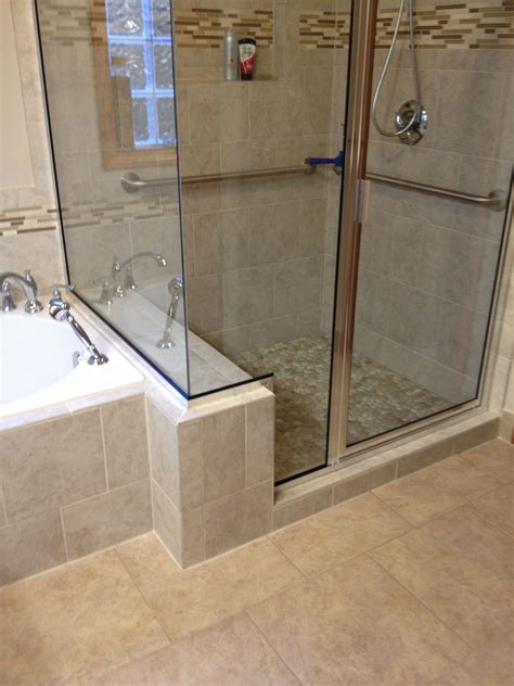 Tile shower with bench seat in Cambria quartz, Tiled wall niche, Moen grab bar, Euro shower doo