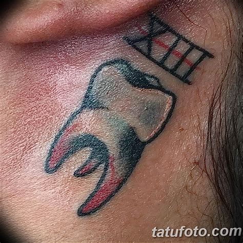 The Meaning Behind Tooth Tattoo TattoosWin