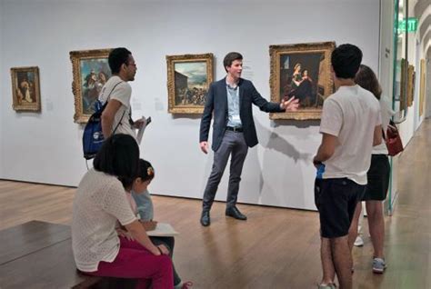 Tour guide explaining art