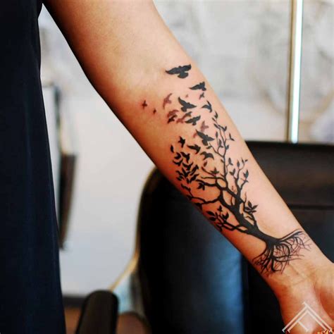 Tree with birds tattoo