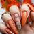 Trendy Fall Manicures: Nail Your Look with Burnt Orange Nail Polish