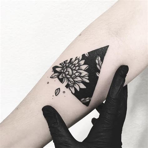 Fleur-de-lis and Floral Accents: Elevate Your Look with a Triangle Tattoo With Flowers