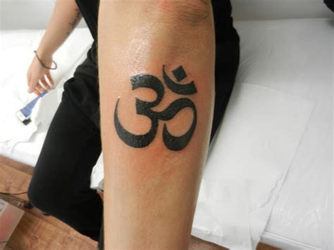 Ohm Tattoo in inner ankle! Wrist tattoos for women, Cute