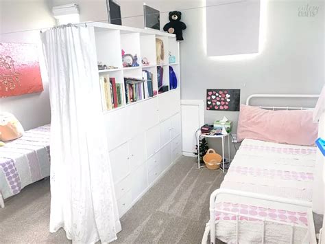 Two girls sharing a bedroom with a divider