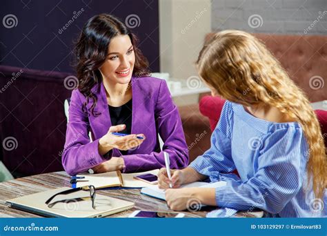 Two people talking and gesturing