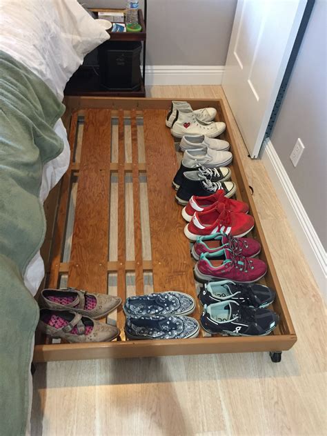 Rolling under bed shoe rack, made from our old closet doors Under bed shoe storage, Old closet
