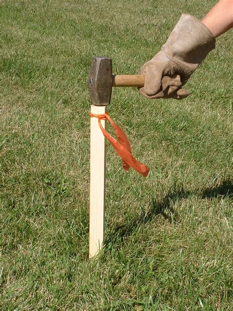 Using a Hammer to Put Stakes into the Ground