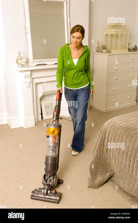 Vacuuming a wool carpet in a bedroom