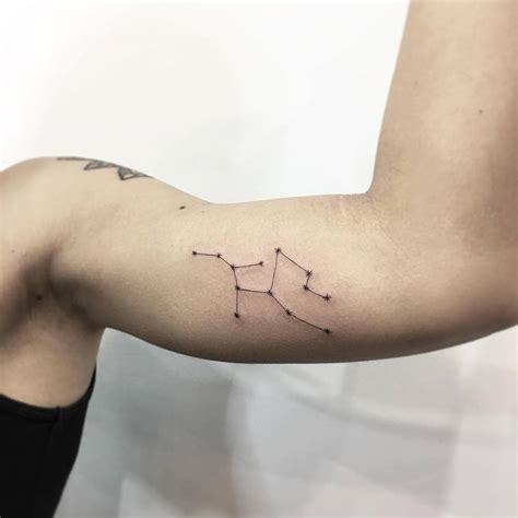 Virgo constellation tattoo on the bicep. Virgo