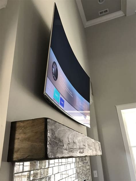 Samsung curved TV Wall mounted tv, Curved tvs, Fireplace tv mount