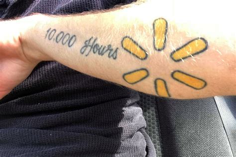 Oakland Raiders neck tattoo in front of a Walmart trashy