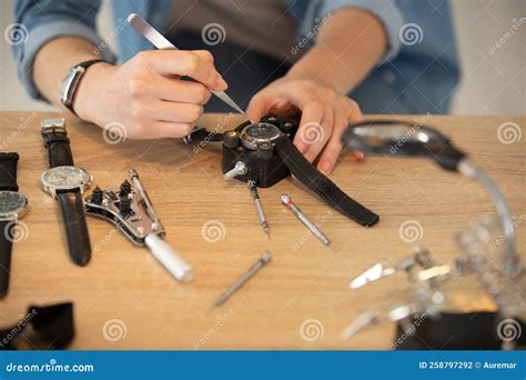 Watch technician fixing a watch