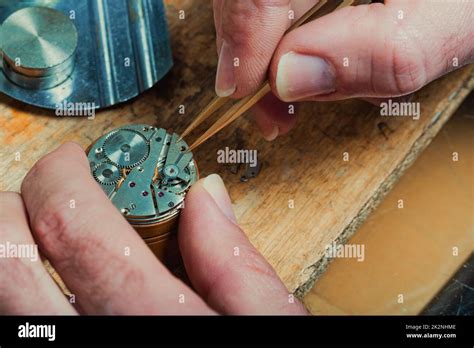 Watchmaker repairing a watch