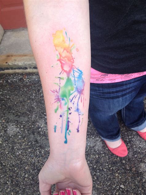 Watercolor paint splash tattoo