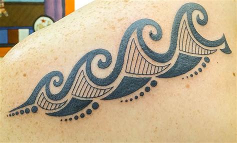 Tribal wave tattoo done by Mark Crouch at Walls of Wonder