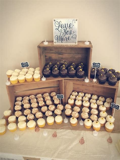 Whimsical Charm and Rustic Elegance: Stunning Wedding Cupcake Display with Vintage Crates!
