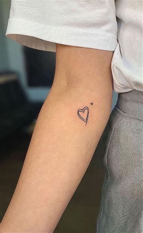 White ink tattoo, heart on wrist White ink tattoo