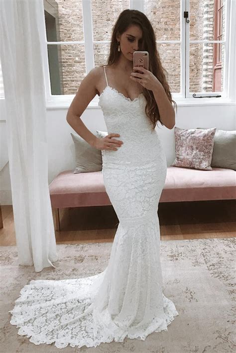 Enchant Your Guests and Charm Your Groom in This Ethereal White Backless Mermaid Wedding Dress