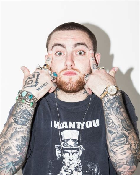 White Rapper With Tattoos On His Face