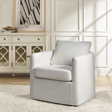 White Slipcovered Swivel Chair