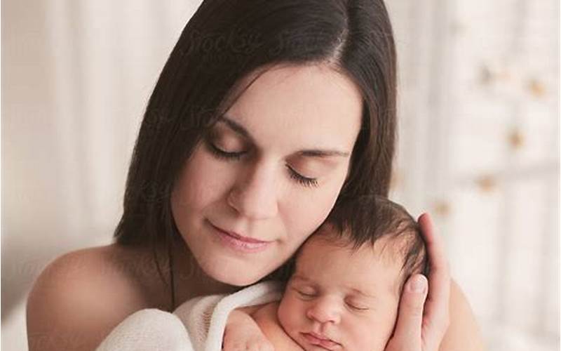 Woman Holding Newborn Baby