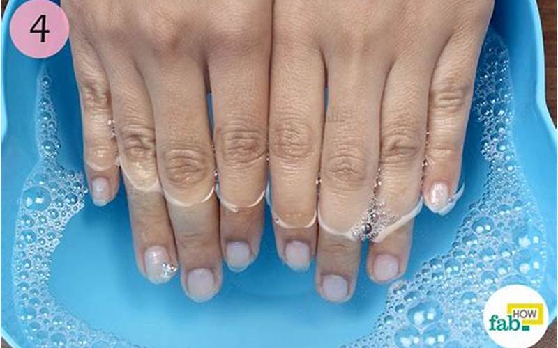 Woman Soaking Nails In Water