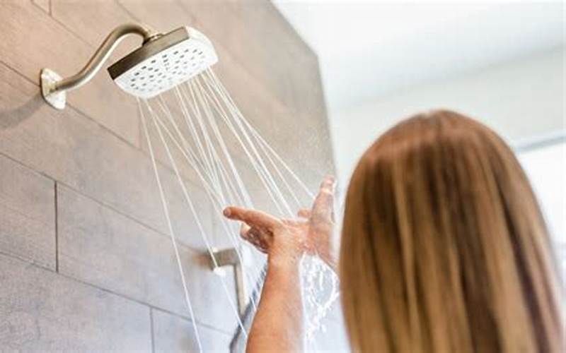 Woman Taking Cold Shower To Reduce Stress